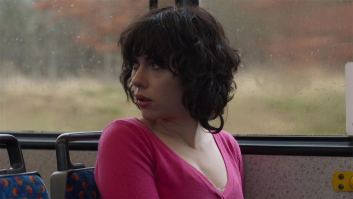 Scarlett Johansson as The Female turning around and looking somewhere off-camera in Under the Skin.