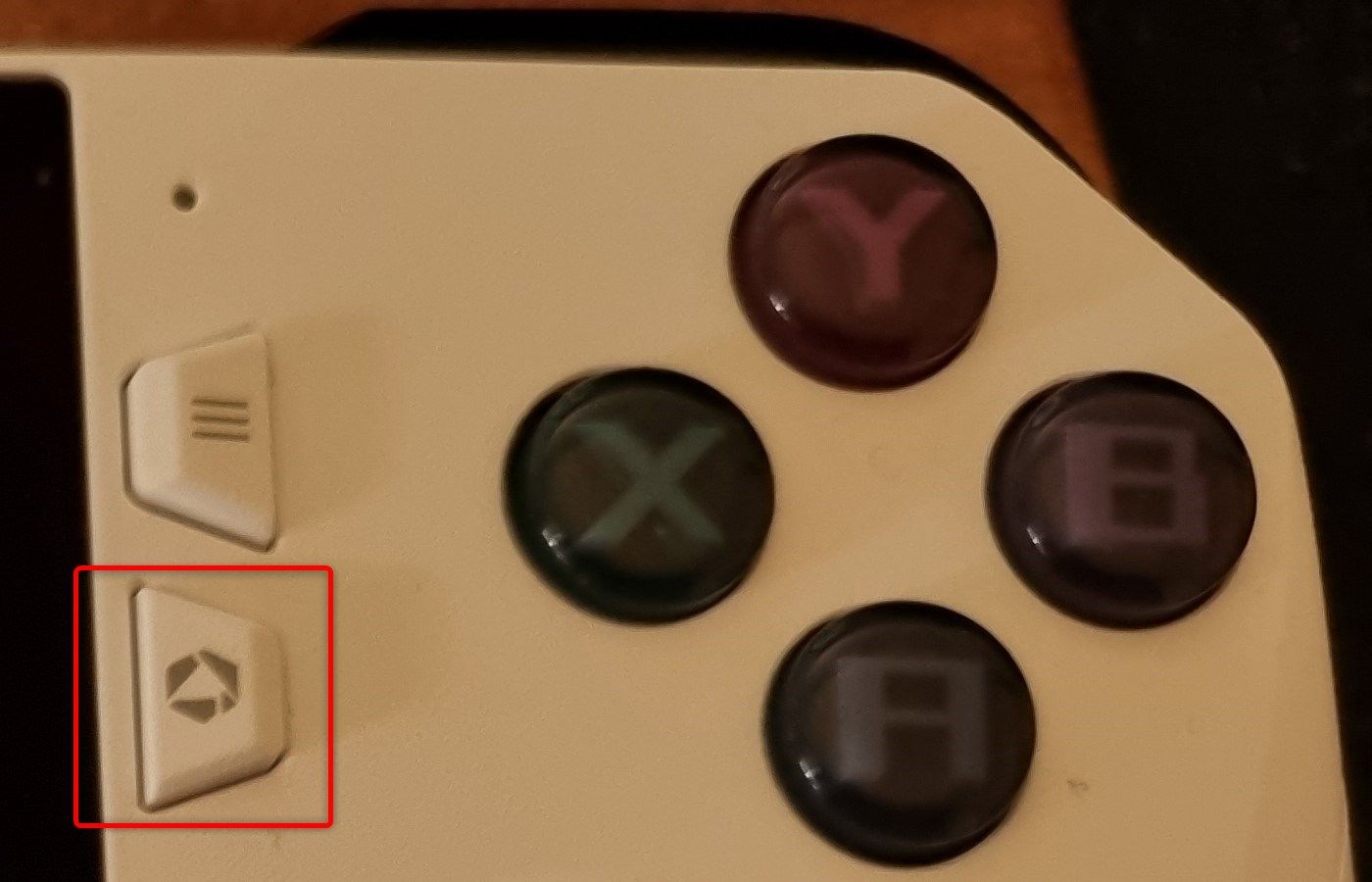 Armoury Crate button on an ASUS ROG Ally. 