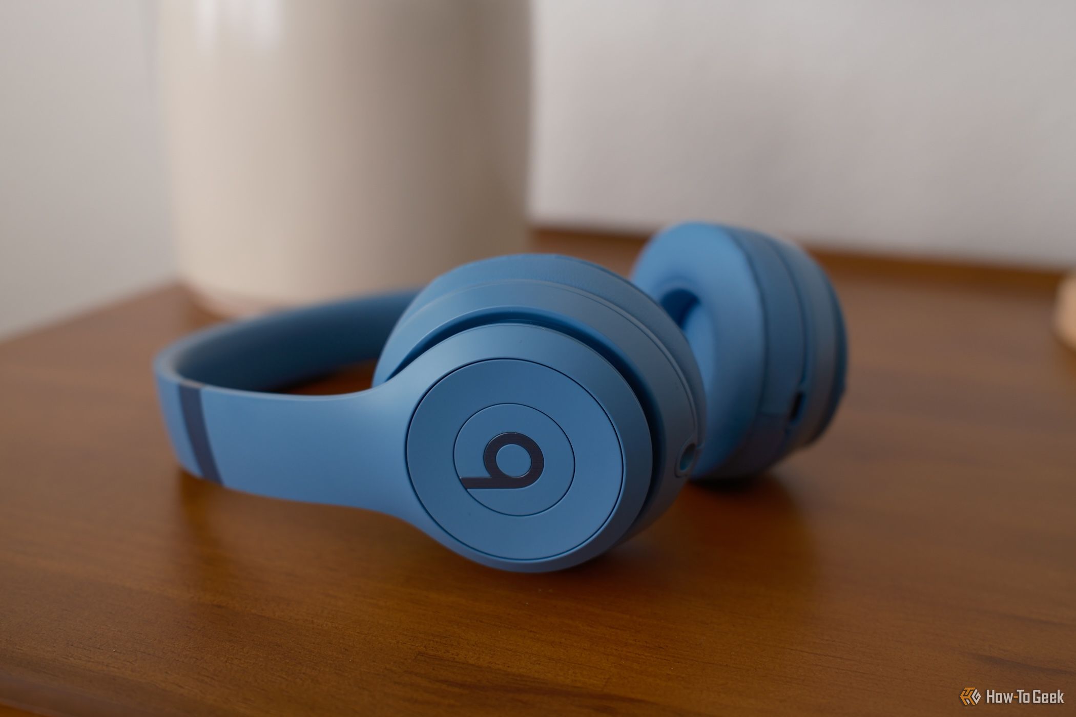 Beats Solo 4 in blue laying on a table