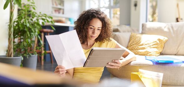 Woman assessing finances at home