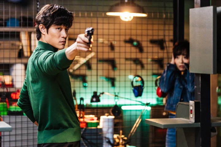 A man aims his gun in City Hunter.