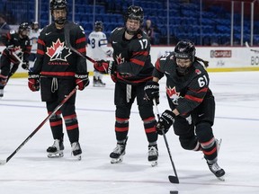 Canada's Danielle Serdachny (92), Ella Shelton (17) and Nicole Gosling (61) warm up before their game against Finland at the IIHF Women's World Hockey Championship in Utica, N.Y., on April 4, 2024.