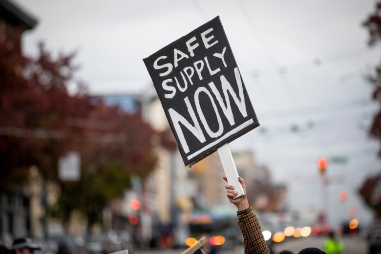 People are pictured during a rally in support of the Drug User Liberation Front’s (DULF)  in Vancouver, British Columbia on Friday, November 3, 2023. 