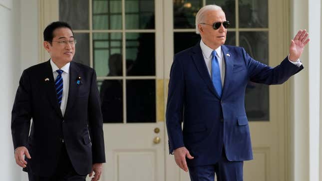 Japanese Prime Minister Fumio Kishida (left) with Joe Biden as the two men walk to the Oval Office on April 10, 2024.
