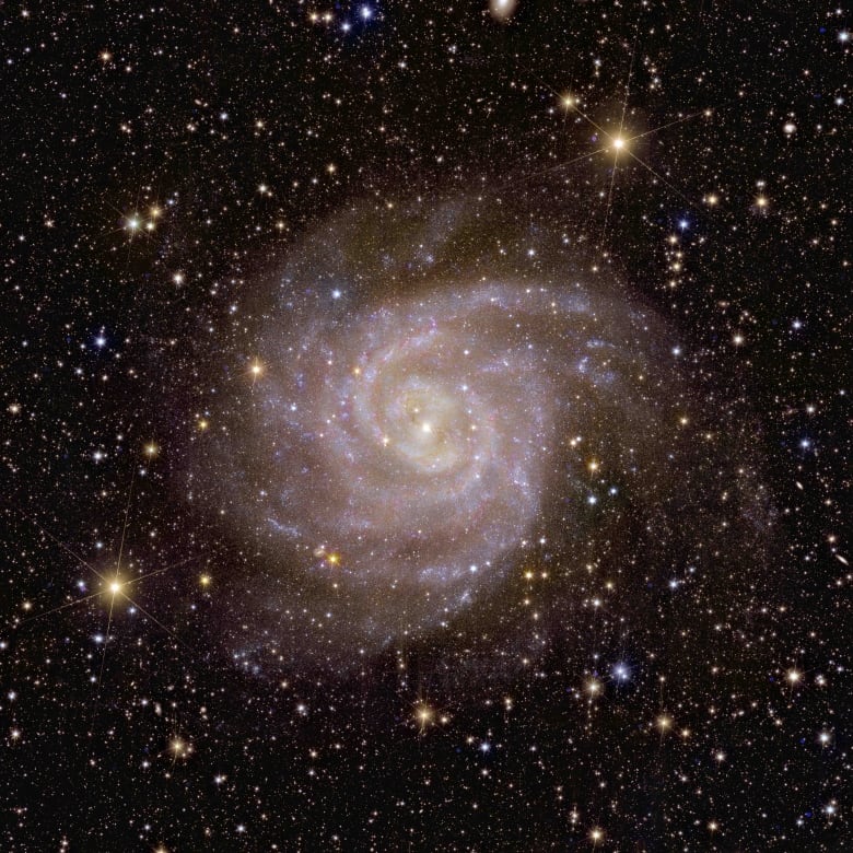 An image shows a spiral galaxy.