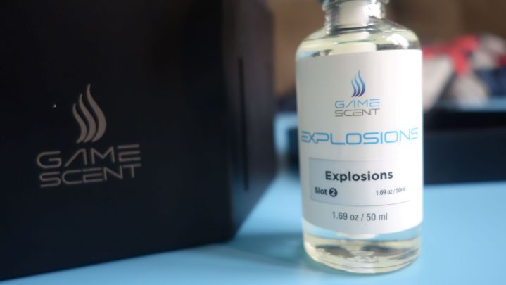 A bottle Explosion scent sits on a table.