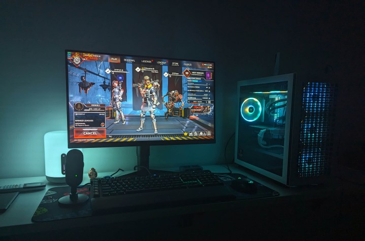 A gaming PC with RGB synced lights running Apex Legends.