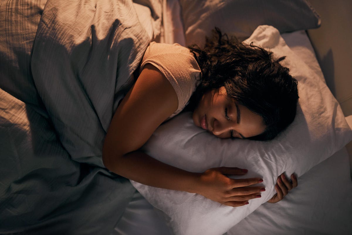 woman sleeping in her bed