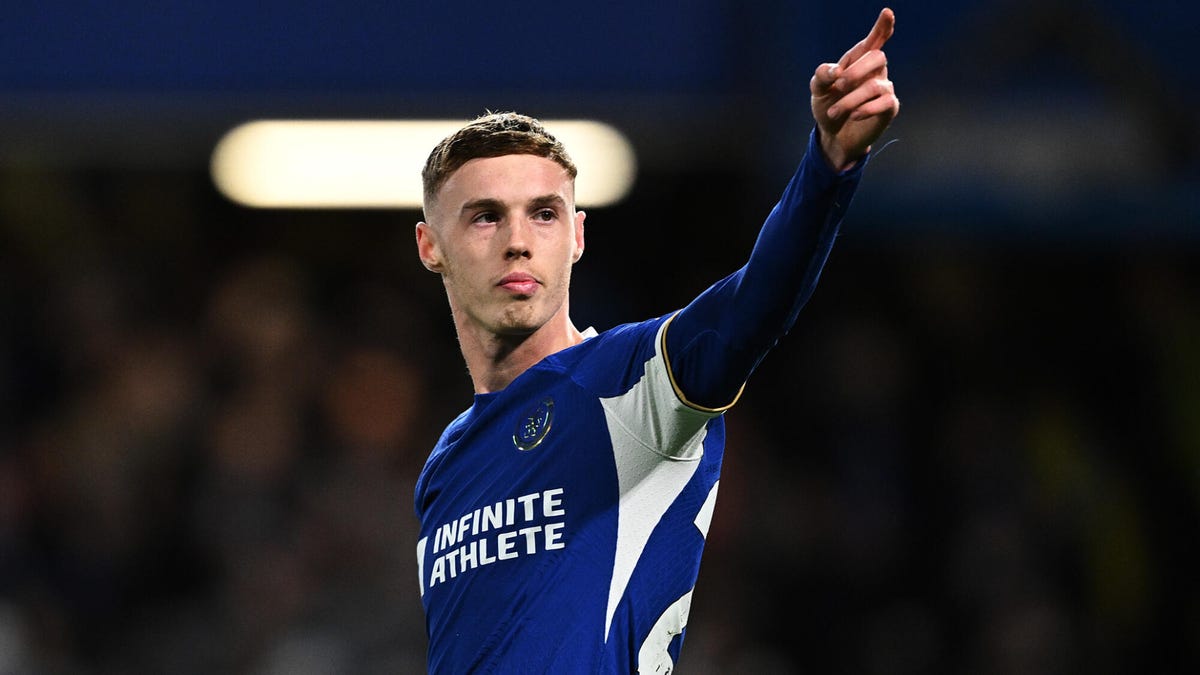 Cole Palmer of Chelsea celebrating, posting upwards with his left hand.