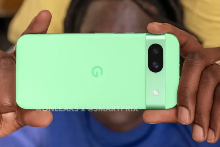 A photo of someone holding the mint Google Pixel 8a.