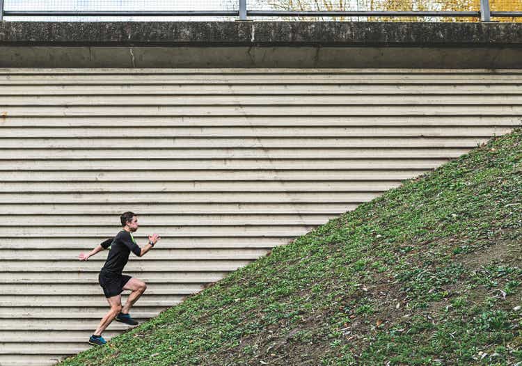 Man running up steep hill