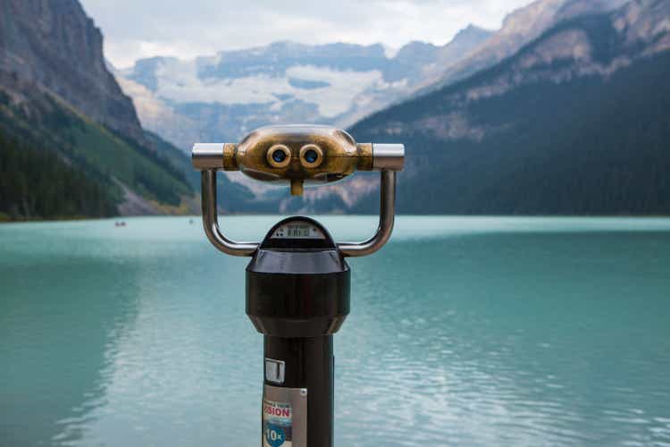 A pair of binoculars looking across Lake Louise.