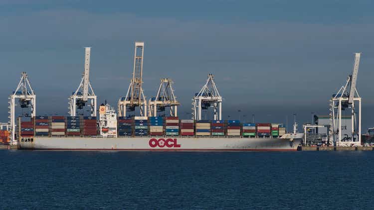 Container terminal of Roberts Bank Superport in the Strait of Georgia, part of Vancouver Harbour with loading vessel OOCL New York and cranes.