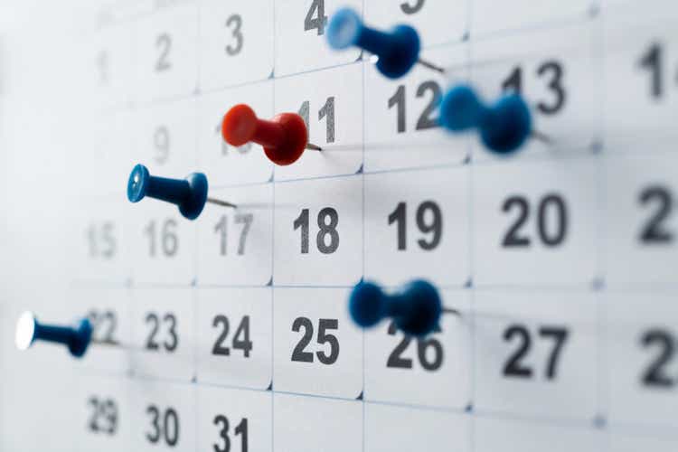 Thumbtack pins on a calendar