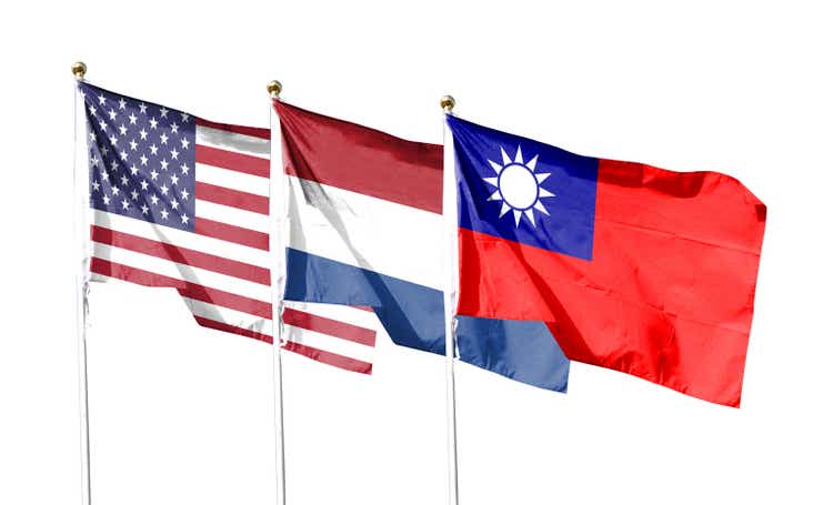 American flag with Taiwan flag and Netherlands flag on cloudy sky. waving in the sky