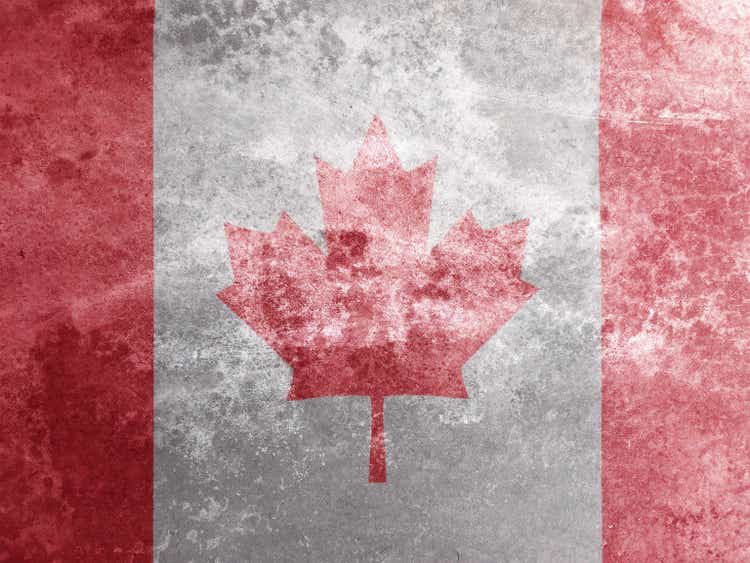 Canadian flag on textured grey cement concrete background