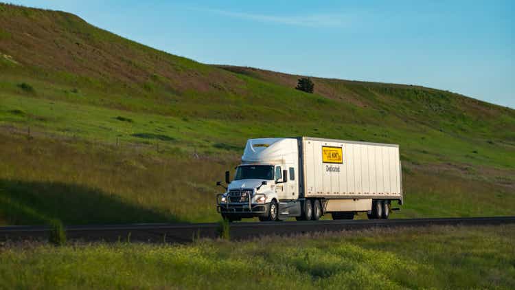 JB Hunt Transportation, Dedicated Contract Services Division, semi-truck driving on Interstate 90 through eastern Washington State, USA.