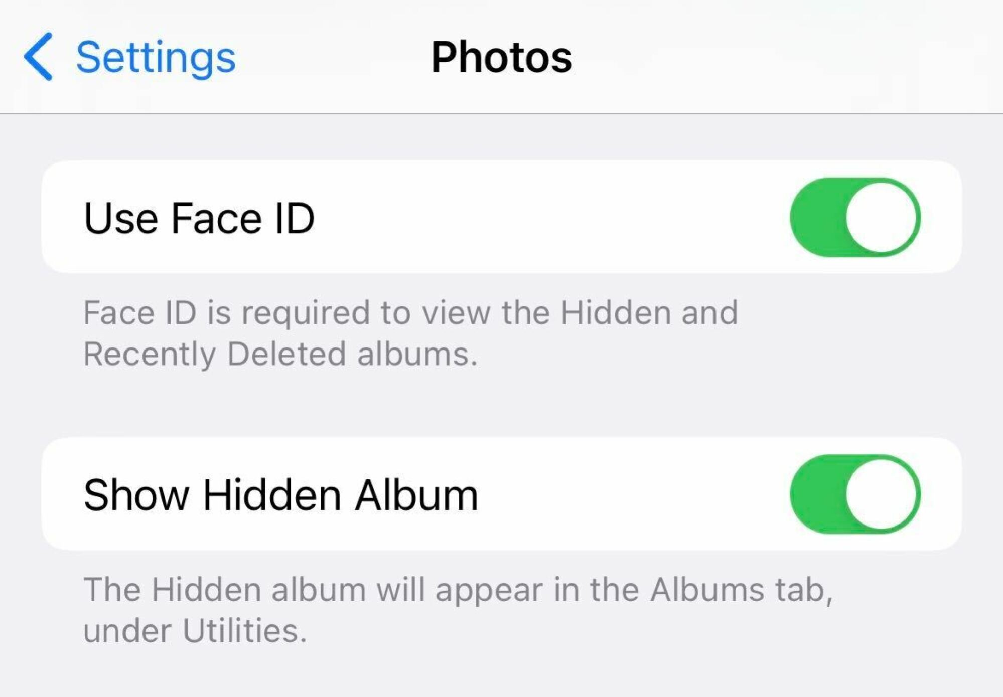 A screenshot of an iPhone showing where to turn on Face ID and "Show Hidden Album"