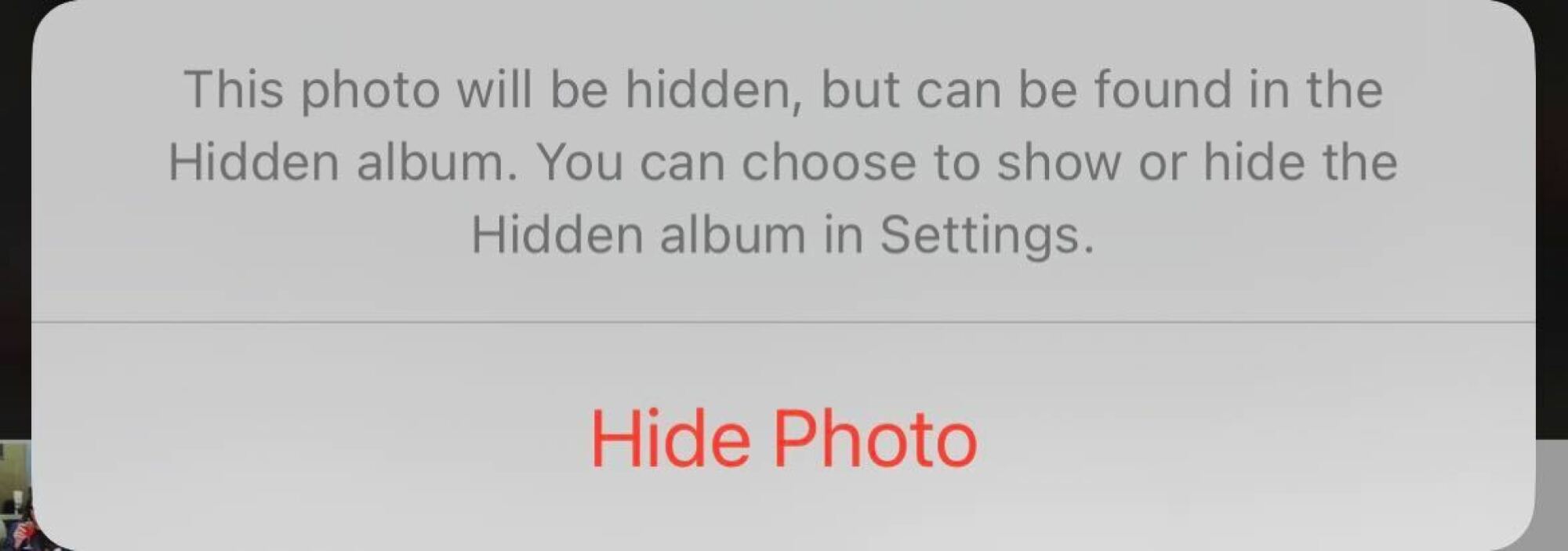 A screenshot of the message that appears when hiding a photo on iPhone.