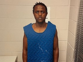 A man faces the camera in a prison cell.