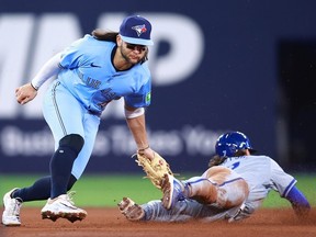 Bobby Witt Jr. of the Kansas City Royals is caught stealing second base by Bo Bichette of the Blue Jays in the sixth inning at Rogers Centre on April 30, 2024 in Toronto.