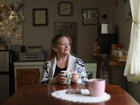 Local resident and postmistress for Canada Post Yvonne Malanfant looks out at the village during coffee in Zeballos, B.C., on Wednesday, April 10, 2024.