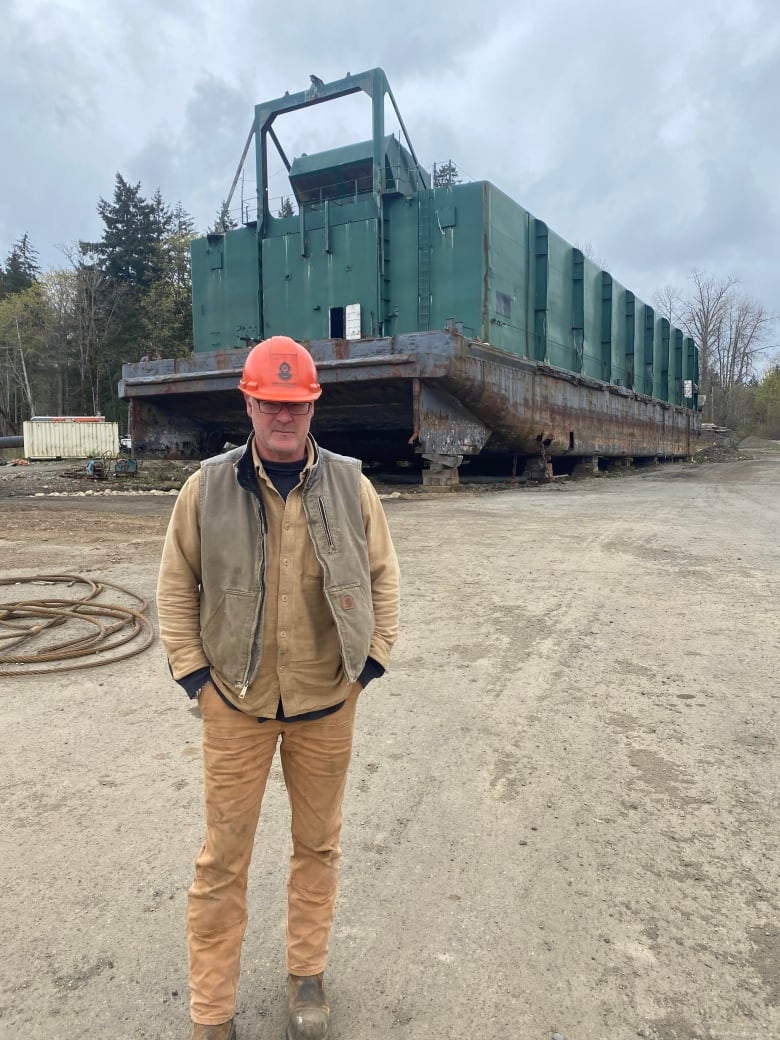 Mark Jurisich stands in yard at union bay at shi breaking operation.