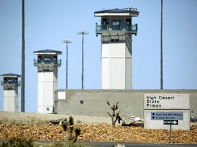 FILE - Towers view over the High Desert State Prison in Indian Springs, Nev., April 15, 2015. The mother of a Nevada prisoner who died in custody in April 2023 alleges in a new lawsuit filed late Thursday, April 11, 2024, that her son, Christian Walker, was violently beaten by prison guards and left to die at High Desert State Prison near Las Vegas.