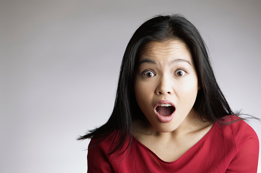 Portrait of Woman Looking Surprised