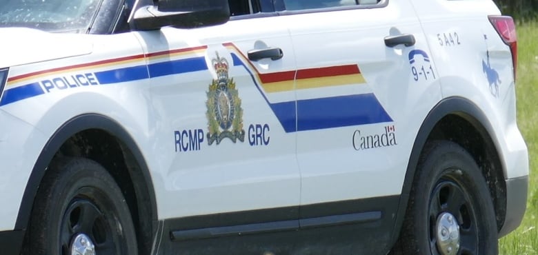 A closeup of the side of an SUV shows the RCMP crest and the words "RCMP GRC," "Police" and "Canada."