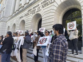 Demonstrators gather outside federal court buildings in New Orleans on Wednesday, April 3, 2024, to protest a Texas law known as SB4. Texas officials appeared before a three-judge federal appeals panel to defend a state law that would allow police to arrest migrants for illegally entering the United States, a week after the same three judges put the law on hold.
