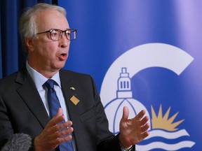 B.C. Conservative Party leader John Rustad speaks to members of the media during a year-end availability at the legislature in Victoria, B.C., on Wednesday, Dec. 6, 2023.