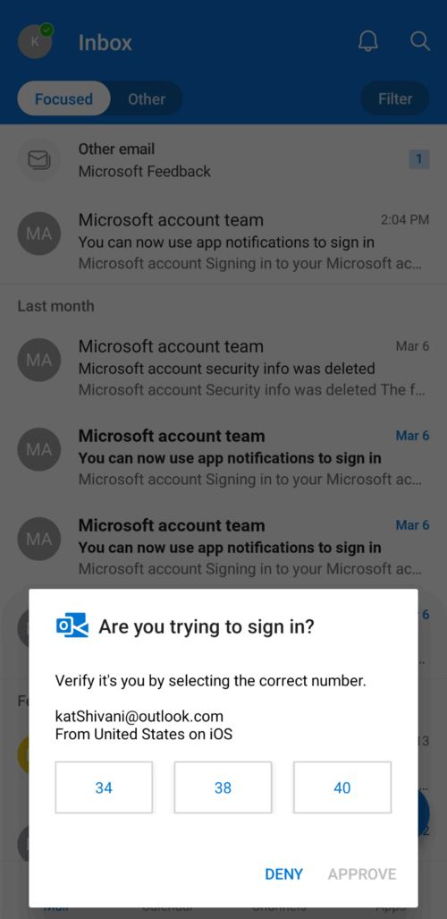 Phone screen displaying a Microsoft sign-in notification with a verification request.