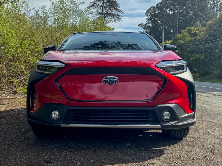 A front-end view of a red 2024 Subaru Solterra.