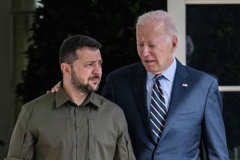 Seen here: Biden has arm around Ukrainian President Volodymyr Zelenskyy, in green military-coloured shirt, at the White House.