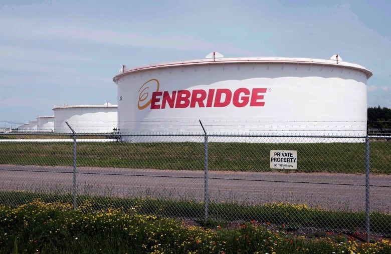 This June 29, 2018 photo shows tanks at the Enbridge Energy terminal in Superior, Wis. For the second time in a year, the federal government is invoking a little-known 1977 energy treaty between Canada and the United States to defend the Line 5 pipeline. This time, it’s in Wisconsin, where Line 5 skirts the southwestern shores of Lake Superior before crossing into Michigan.