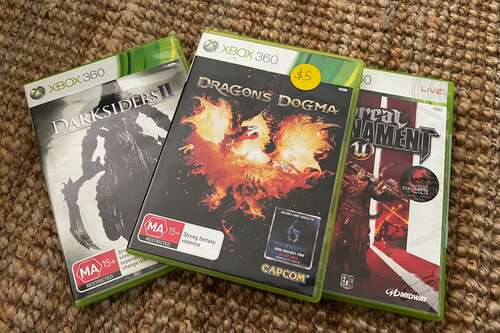 Used copies of Dragon's Dogma, Darksiders II, and Unreal Tournament III for Xbox 360.