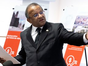 St-Laurent borough mayor Alan DeSousa points off camera.