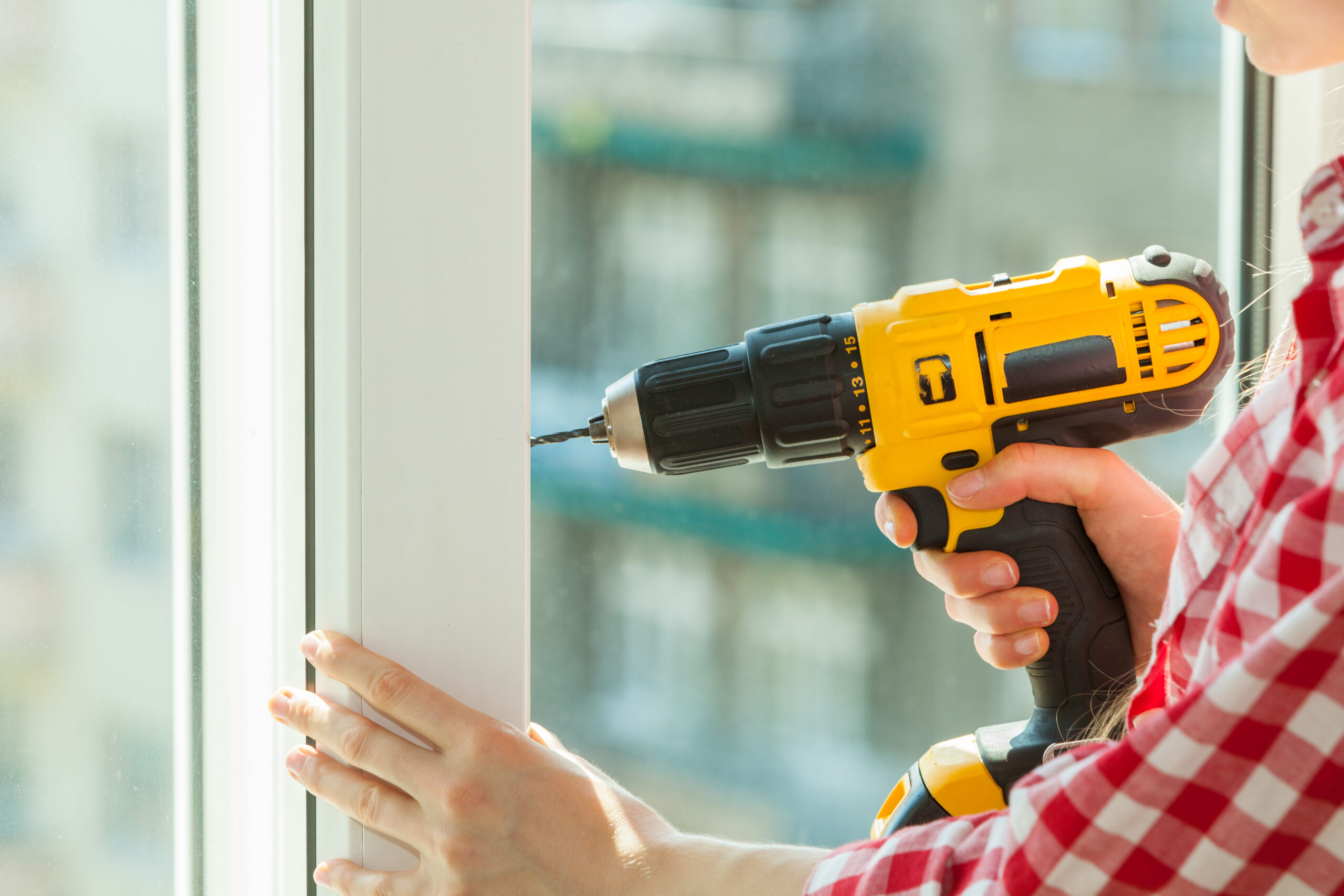 Person using power drill