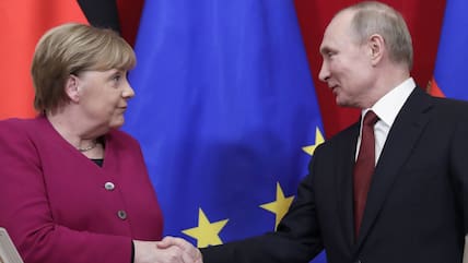 Die frühere Bundeskanzlerin Angela Merkel und Russlands Präsident Wladimir Putin