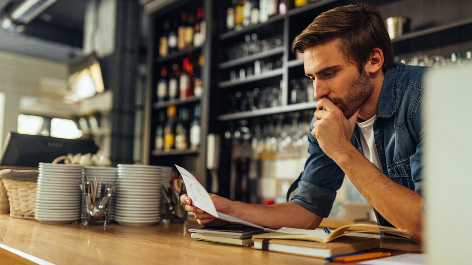 man looking at financials