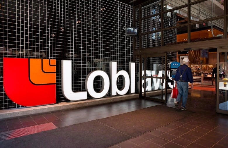 A Loblaws sign is seen outside of a grocery store. 