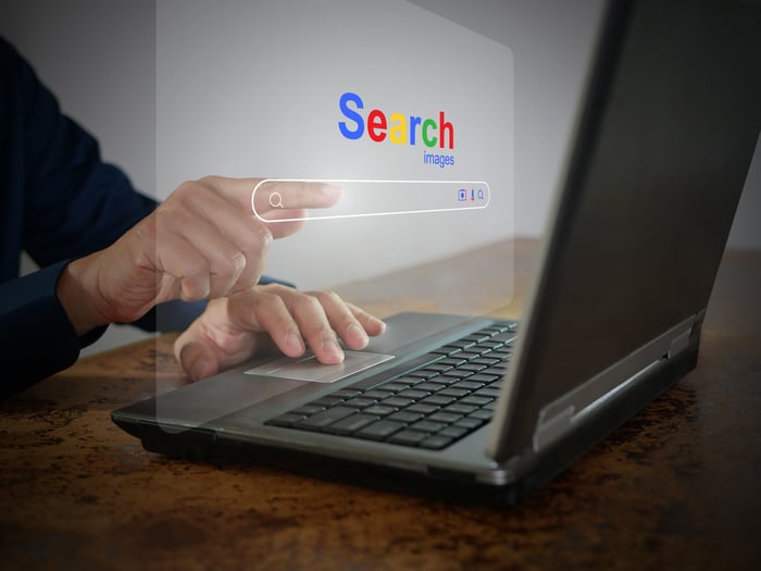 laptop with image of colorful search bar.