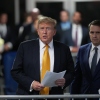 Former U.S. President Donald Trump with attorney Todd Blanche speaks to the media during his trial for allegedly covering up hush money payments, at Manhattan Criminal Court on Tuesday in New York City.