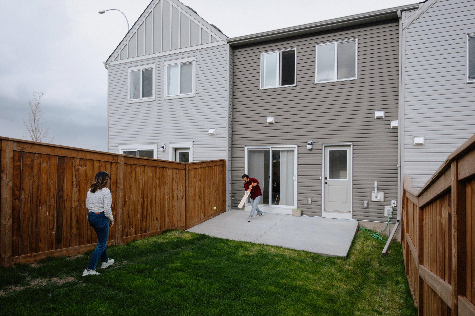 The backyard houses a two-car garage, with plenty of space remaining for other activities.