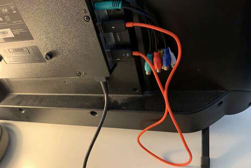 Wireless HDMI adapter plugged in to a TV.