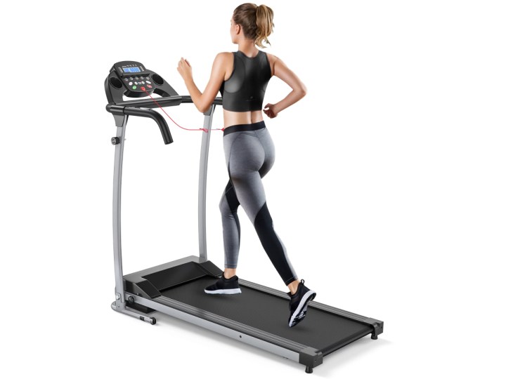 A woman running on a Costway 800W Folding Treadmill.