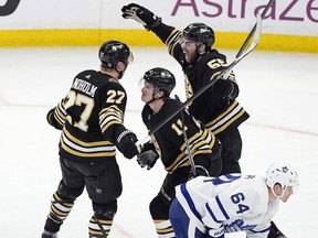 Bruins d-man Hampus Lindholm 27) celebrates his game-tying goal versus the Leafs on Saturday. AP