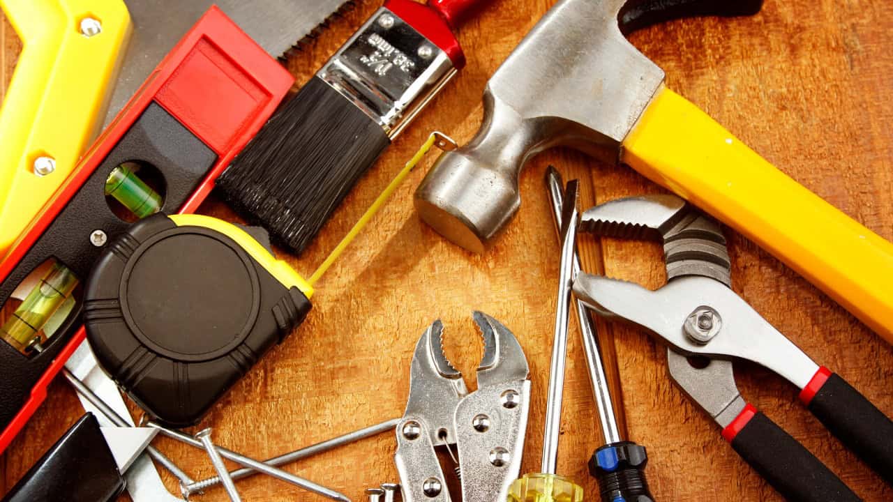 Assorted work tools on wood