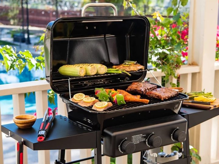 The Expert Grill 3-Burner Propane Gas Grill can tuck extra food in the opened lid.